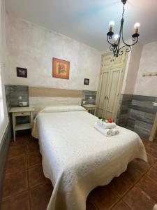 A bed or beds in a room at Casas Guemon