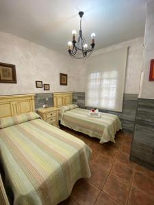 A bed or beds in a room at Casas Guemon