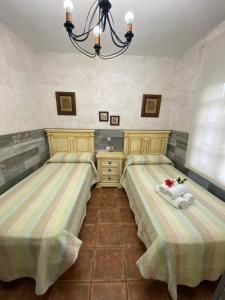 A bed or beds in a room at Casas Guemon