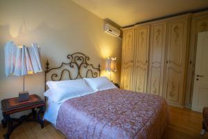 Postel nebo postele na pokoji v ubytování Palazzo Rocchi - Residenza D'Epoca