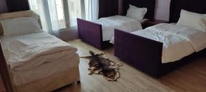 Ένα ή περισσότερα κρεβάτια σε δωμάτιο στο Hostel Dar Alslam