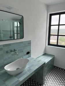 a bathroom with a sink and a mirror at Eifel-Bau-Traum Schlich in Wershofen