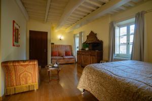 Postel nebo postele na pokoji v ubytování Palazzo Rocchi - Residenza D'Epoca