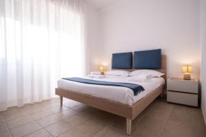 Voodi või voodid majutusasutuse Nautika Suites toas