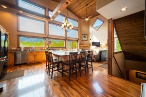 a kitchen and dining room with a table and chairs at Stunning Views, Luxury, Near Whiteface,Lake Placid in Wilmington