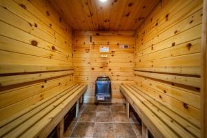 a wooden sauna with a cooler in the middle at Stunning Views, Luxury, Near Whiteface,Lake Placid in Wilmington