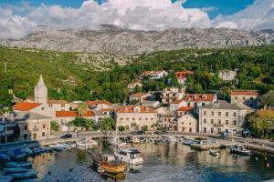 a town with a harbor with boats in the water at Kul IN Ablana in Jablanac