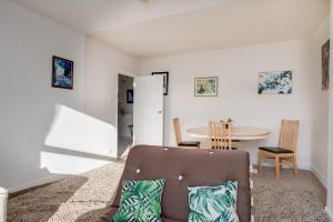 a living room with a chair and a table at Seaview Central in Portsmouth