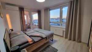 Postel nebo postele na pokoji v ubytování Apartmán 402