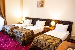 Voodi või voodid majutusasutuse George Hotel toas