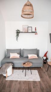 a living room with a couch and a table at Pokój Dziupla in Tarnawa Dolna