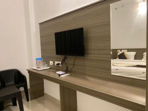 TV a/nebo společenská místnost v ubytování Le Poshe Beach View