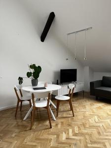 a living room with a white table and chairs at High Standard Room in Jewish District, Apartment Shared with Host in Kraków