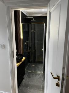 a bathroom with a shower with a glass shower stall at High Standard Room in Jewish District, Apartment Shared with Host in Krakow