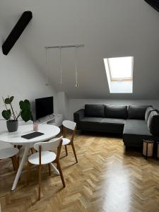 a living room with a couch and a table at High Standard Room in Jewish District, Apartment Shared with Host in Krakow