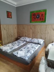 a bedroom with a bed in a room with at Apartments Manhattan in Teplice