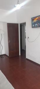 a room with a door and a tile floor at Casa alquiler temporario Necochea in Necochea