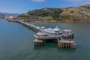 a cruise ship docked at a dock in the water at Conwy Cottage in Conwy