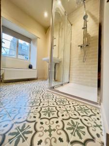 a bathroom with a shower and a sink at Large room in Stunning Cottage Edge of the Cotswolds in Bloxham