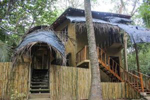 a tree house with stairs leading to it at Seasons Four Eco Friendly Cabana MATARA in Matara