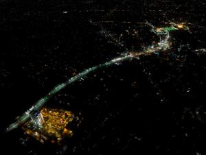 an aerial view of a city at night at The Baron Hotel - Karbala in Karbalāʼ