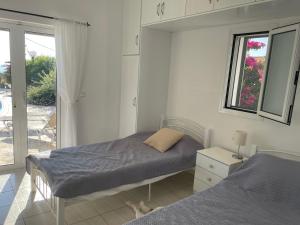 Postel nebo postele na pokoji v ubytování Villa Eleni + 27 fotografií