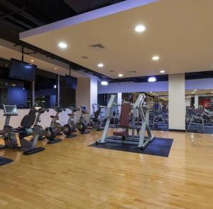 a gym with several treadmills and exercise bikes at JW MARRIOT in Panama City