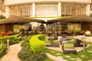 a building with tables and chairs in front of it at JW MARRIOT in Panama City