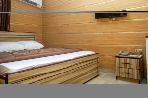 Uma cama ou camas num quarto em Haffy Executive Hotels and Suite
