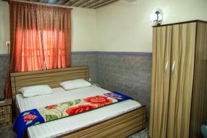 Uma cama ou camas num quarto em Haffy Executive Hotels and Suite