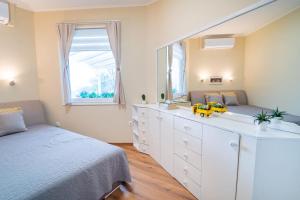 A bed or beds in a room at ABG House Pest