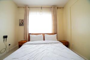 Katil atau katil-katil dalam bilik di Airport Vista Getaway-4km from jomo Kenyatta International Airport