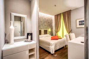 A bed or beds in a room at Boutique Rome Inn