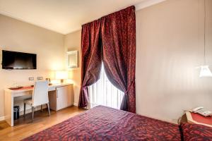 A bed or beds in a room at Boutique Rome Inn
