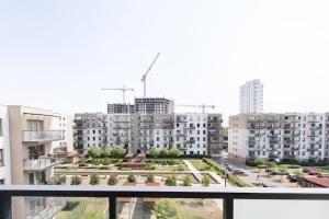 a view from a balcony of a city with buildings at Apartament MioMare Letnica Seaside in Gdańsk