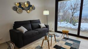 Posezení v ubytování Le Cosy - joliment aménagé - vue magnifique
