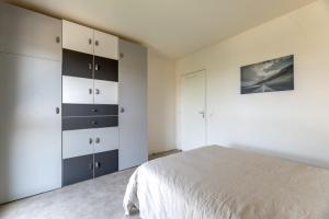 Ένα ή περισσότερα κρεβάτια σε δωμάτιο στο Appartement du Blanchet très agréable