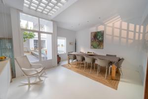 a dining room with a table and chairs at Ca Sa Padrina d'Artà-Turismo de Interior in Artá