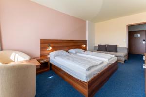 Ένα ή περισσότερα κρεβάτια σε δωμάτιο στο Lipno Wellness - Frymburk C104 privat family room
