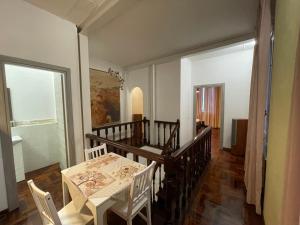 a dining room with a table and chairs at Garden suite / del ducato in Parma