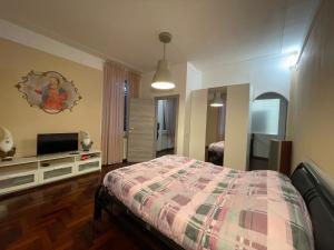 Кровать или кровати в номере Garden suite / del ducato
