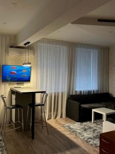 En TV eller et underholdningssystem på Apartments Superdom