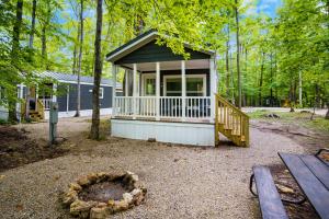 a small cabin in the middle of a forest at HTR Door County in Egg Harbor