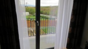 a window with a view of a balcony at Casa MaMi 2 in Sibiu