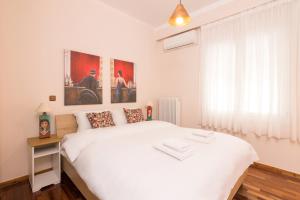 Ένα ή περισσότερα κρεβάτια σε δωμάτιο στο Three Bedrooms Apt in Kallithea
