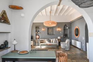 a living room with a table and a couch at Spectacular View in Istérnia