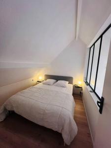Postel nebo postele na pokoji v ubytování La dunette