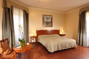 Кровать или кровати в номере Hotel Alessandrino