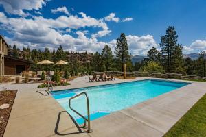 a swimming pool in the middle of a yard at Tamarron Gambel Oak - 731 in Durango
