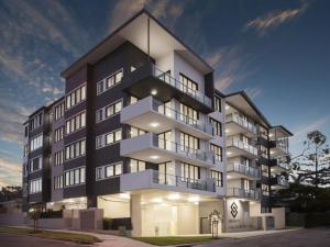 an apartment building with a black and white facade at Central of Toowong Neat Apt Near Station in Brisbane